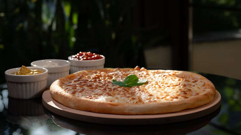 Four Cheese pizza with mozzarella, asiago, feta, and romano