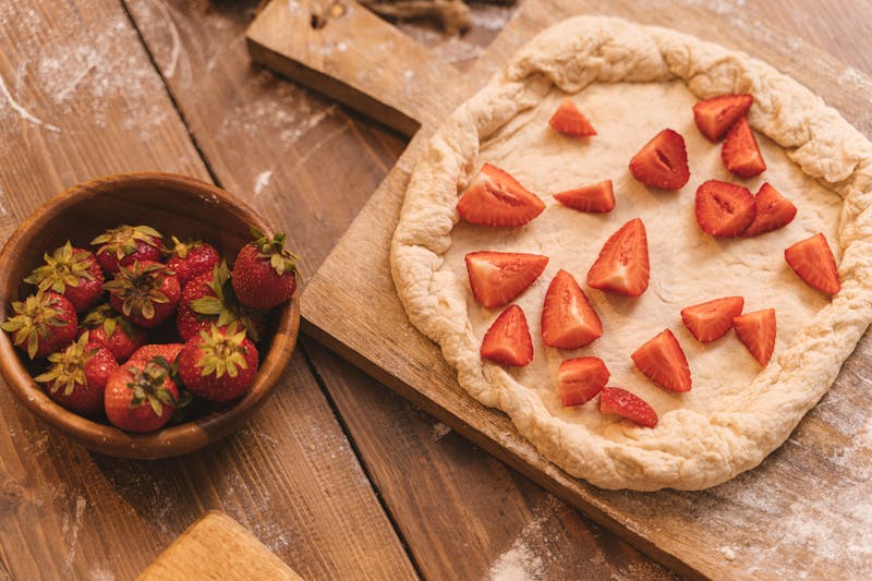 Nutella pizza dessert with strawberries and powdered sugar