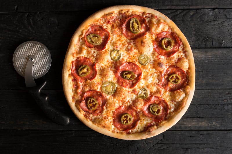 Lucy Sunshine pizza with olive oil, lemon, and artichoke